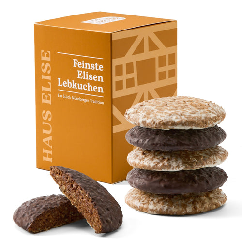 HAUS ELISE Elisen-Lebkuchen 6er Box mit Fachwerk-Motiv, daneben sechs gemischte Lebkuchen mit Anschnitt