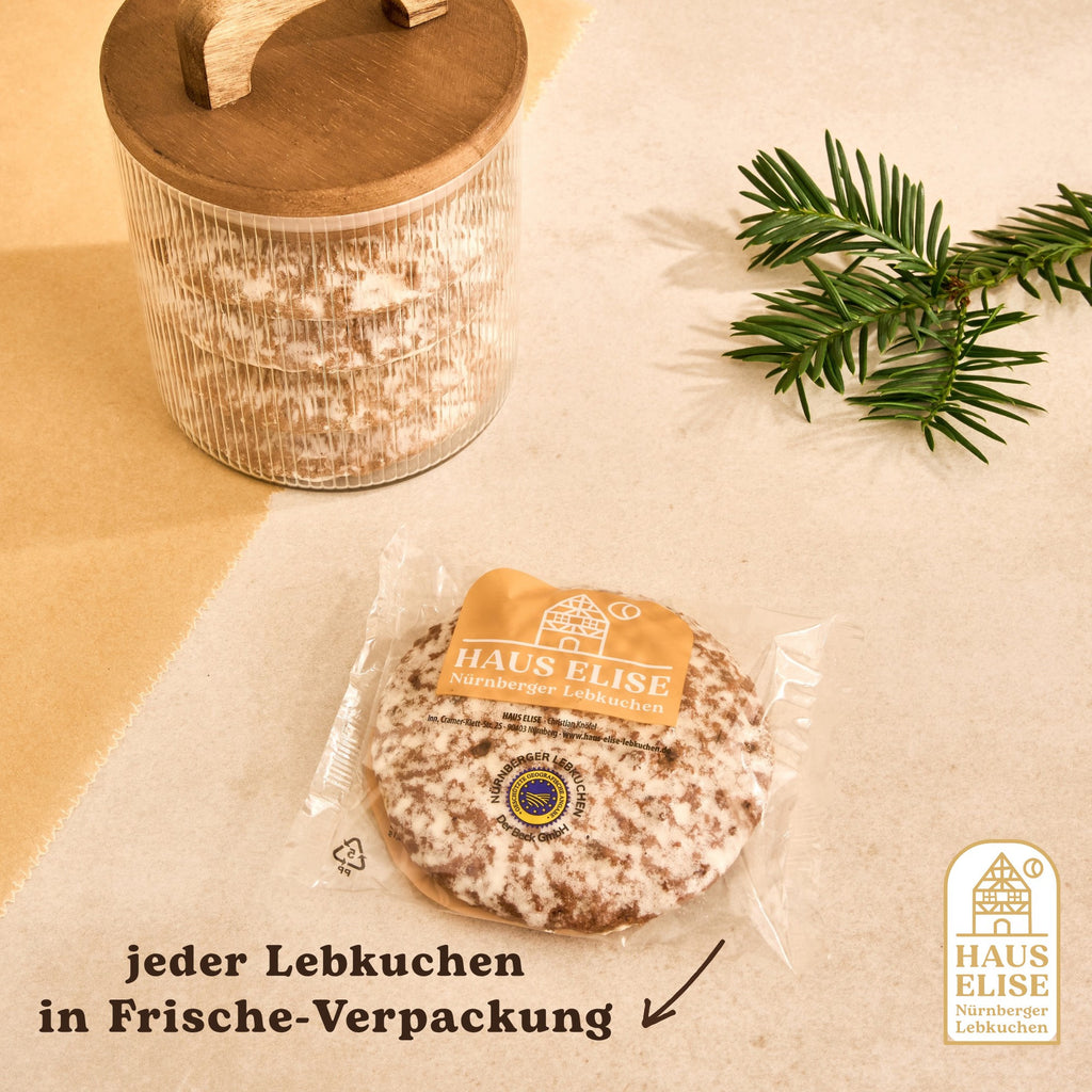 Einzeln in Folie verpackter glasierter Elisen-Lebkuchen mit Vorratsglas